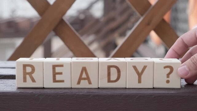 ready ?, motivational word, laying out  by hand from letters on wooden cubes, slow motion

