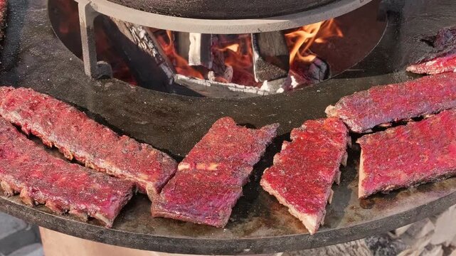 barbecue ribs are cooked on a smoker, slow motion
