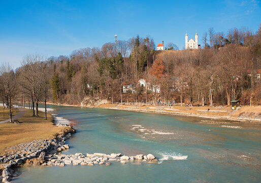 view over Isar river to calvary hill with chapels. bare trees in winter season. Bad Tolz