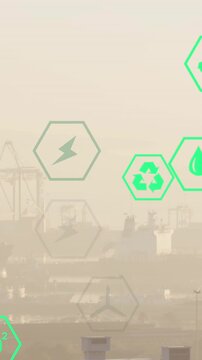 Multiple green energy icons floating against aerial view of cityscape