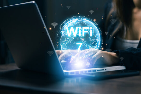 Business professional using laptop with futuristic WiFi 7 globe interface, illustrating high speed wireless internet, global connectivity, digital networking, technology, and communication.