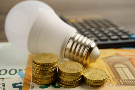 Cost of electric utilities with light bulb for payment.