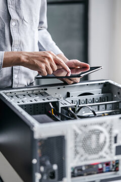 Computer repair technician specialist repairing and testing on Pc