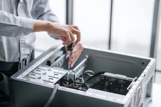 Computer repair technician specialist repairing and testing on Pc