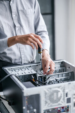 Computer repair technician specialist repairing and testing on Pc