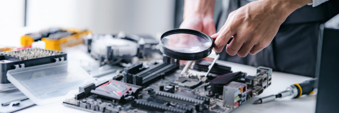 Computer repair technician specialist repairing and testing on Pc