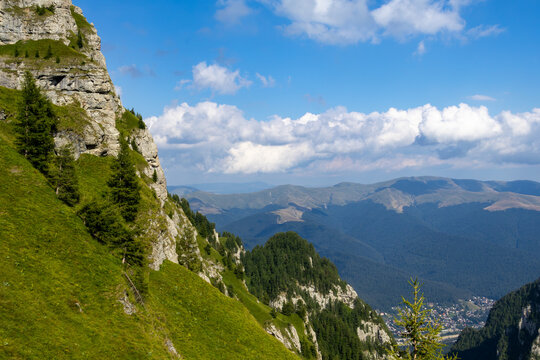 Panoramic Aerial View of Bușteni Valley from Steep Bucegi Mountain Ridge