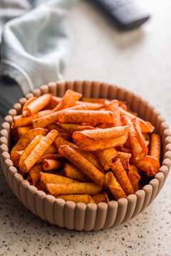 Spicy Rolled Snack Chips in a Bowl Ready for Movie Night or Casual TV Snacking