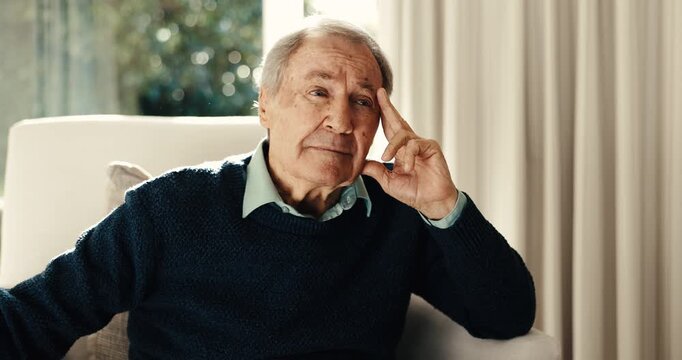 Thinking, sad and old man in home with headache, anxiety trigger and regret with trauma memory. Mental health, bokeh and senior person with migraine, overthinking and flashback in emotional thoughts.