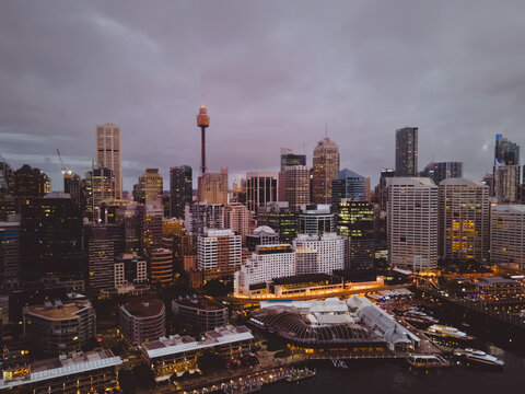 A picture of a modern waterfront precinct in Sydney - Barangaroo with a nigh coming to the city