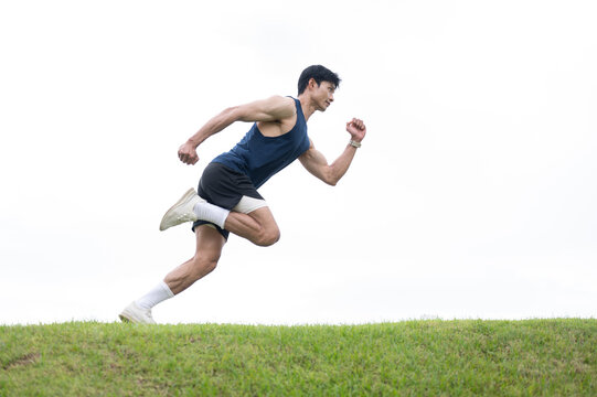 Athletic Asian Man Jumping During Sprint Training