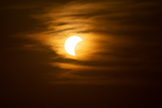 solar eclipse the moon obscures the sun sunset in the mountains