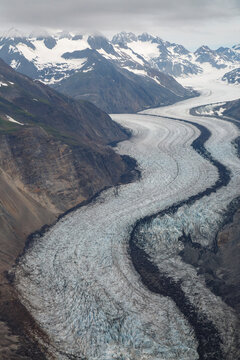 Aerial View of winding Glacier Snow Capped Mountains Near Haines