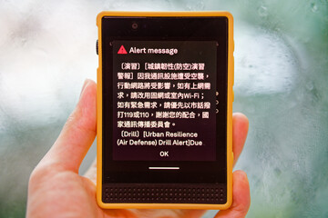 Fototapeta premium Taiwan phone shows PWS alert for first Han Kuang network throttle drill, Chinese