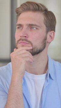 Portrait of Pensive Young Creative Man Thinking, Vertical Video