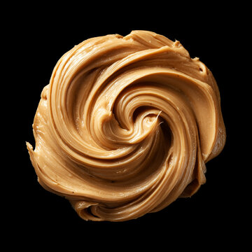Closeup creamy peanut butter swirl on black background with clipping path, concept of food texture and flavor richness