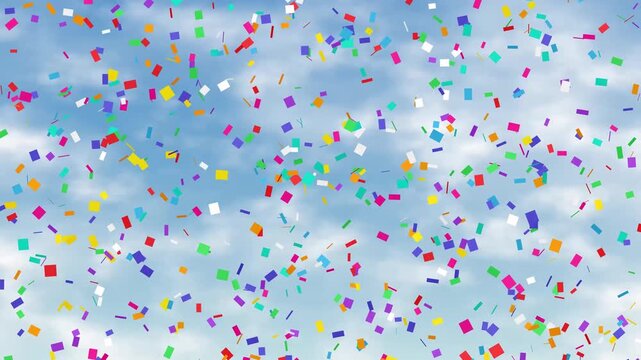 Colorful Confetti Falling Against a Bright Blue Cloudy Sky Background