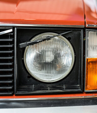 Gothenburg, Sweden - May 30 2026: Round classic Volvo headlight and amber indicator detail indoors.