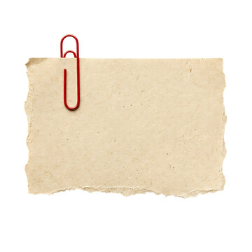 Beige paper note with red paperclip for creative office and design.