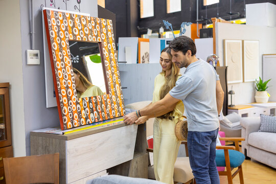 Couple shopping for furniture in a home decor store