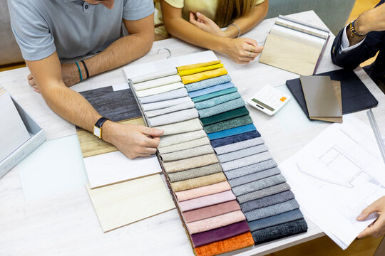 People choosing materials for interior design project