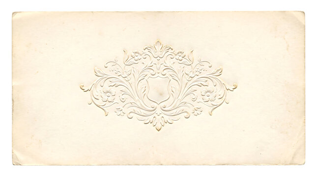Ornate embossed decorative frame with floral and scrollwork design on aged paper