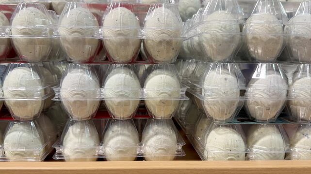 Egg Cartons Stacked on Supermarket Refrigerated Shelf &ndash; Assorted Chicken Eggs in Various Packaging Sizes, Including White and Brown Eggs
