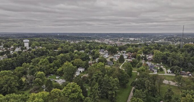 Zanesville Ohio Aerial v1 flyover above residential neighborhoods and the freeway toward the town center and wooded hillsides - Shot with Mavic 3 Pro Cine - Sept 22nd 2023