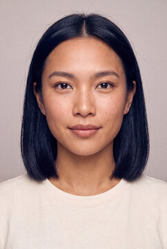 Natural skincare portrait of relaxed asian woman with freckled skin for beauty and wellness banner design