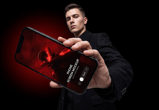 Man Showing Mobile Phone Screen Mockup on Dark Background