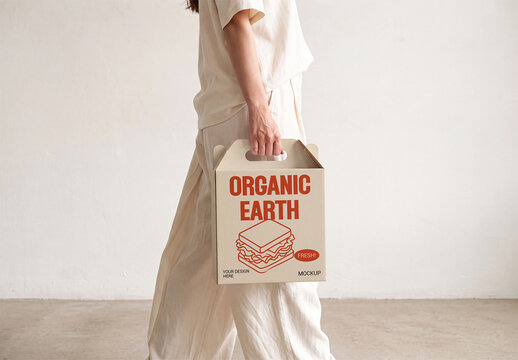 Woman Carrying Kraft Paper Food Box Mockup