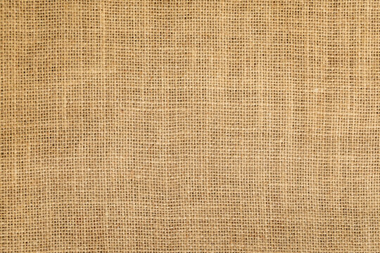 Brown linen fabric texture or background, horizontal shape