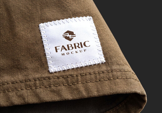Woven Clothing Label Patch Mockup on Brown Fabric Texture