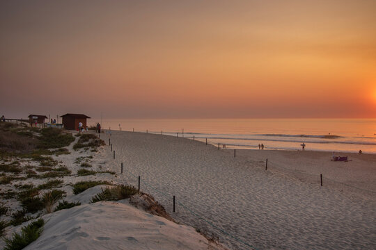 Sandy beach on the atlantic coast at sunset in Portugal