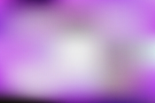 Abstract purple gradient background with soft grainy texture and blurred light effect.