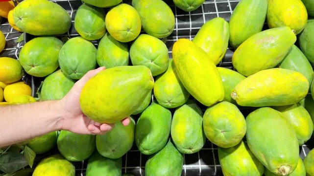Fresh Tropical Fruits on Display in Supermarket Produce Section &ndash; Assorted Mangoes, Dragon Fruit and Passion Fruit Stacked at the Vegetable Counter