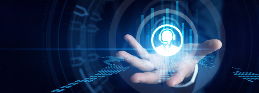 Support agent shown by assisting clients through a virtual Customer Service portal on a dual monitor setup to ensure maximum client satisfaction. Interactive global communication tools.