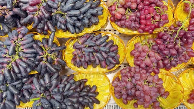 Fresh Grape Varieties in Supermarket Fruit Section &ndash; Green, Red and Black Table Grapes on Display