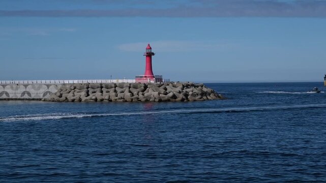 View of the Red Lighthouse and the sea from Yangyang Beach in Sokcho, South Korea