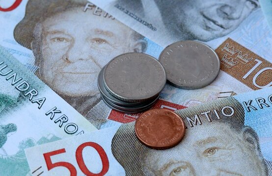 Swedish krona money banknotes and coins on table. Sweden cash bills of SEK currency