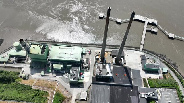 downview of riverside electric powerstation,Stunning aerial perspective of electricity production facility beside the River Suir in Wexford, Ireland.