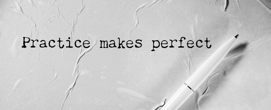 practice makes perfect concept text on notebook