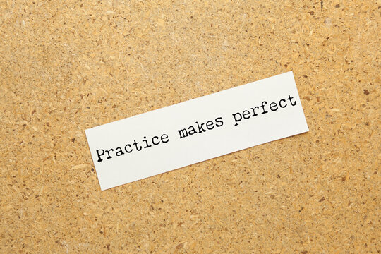 practice makes perfect concept text on notebook