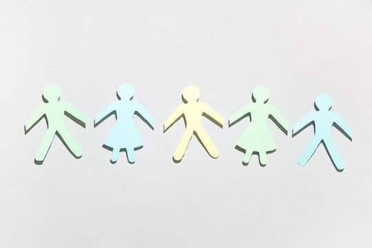 Paper human figures on grey background