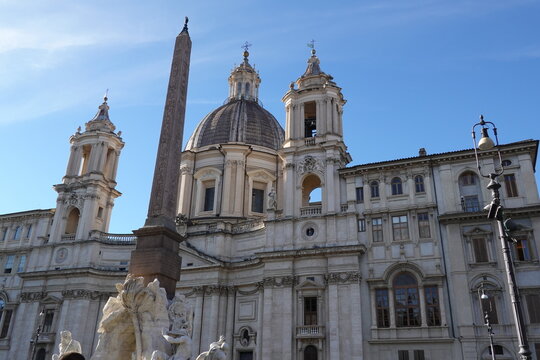 The magnificent Fontana dei Quattro Fiumi with its obelisk and Sant Agnese in Agone church at Piazza Navona in Rome, Italy.
