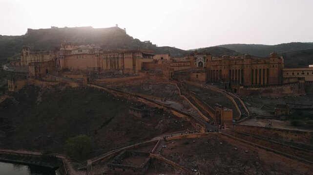 Aerial view of amber fort, a unesco world heritage site in jaipur, india, during a sunset over the aravalli hills