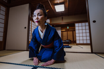 Beautiful japanese woman in a traditional japanese house © oneinchpunch