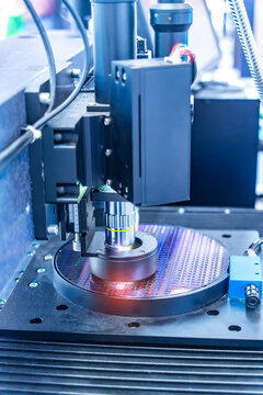 Silicon Wafers with microchips used in electronics for the fabrication of integrated circuits under the microscope,integrated circuits to manufacture CPU and GPU
