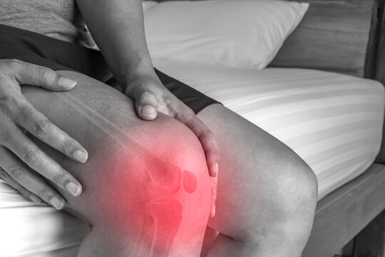 Knee pain highlighted with red glow showing patient discomfort reflecting medical symptom and healthcare treatment concept.