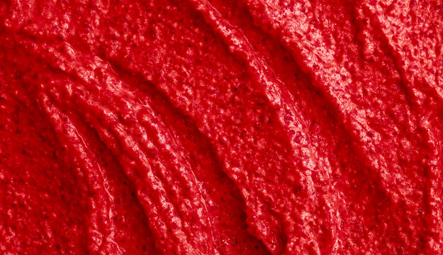 Red berry yogurt ice cream. Fresh fruit smoothie with strawberries, raspberries, pomegranate and red currants. Ice cream texture. Delicious sweet dessert close-up as a background.